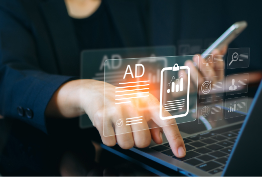 Person using a laptop and smartphone with digital icons displaying advertisements and data analytics, highlighting concepts like online advertising, digital marketing, and the risks of SEO poisoning.