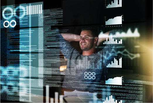 A man sits at a desk, smiling with hands behind head, surrounded by floating data charts and code on transparent digital screens analyzing SEO poisoning threats.
